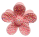 Pink flower-shaped object with glittery beads on a white background