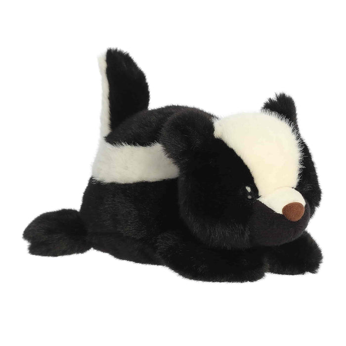 A Skunk plush toy laying flat on a white background