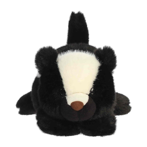 A Skunk plush toy laying flat on a white background