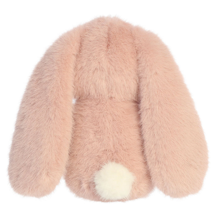 Pink plush bunny toy with a white tail on a white background