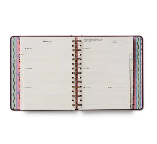 Open planner with colorful design on a white background