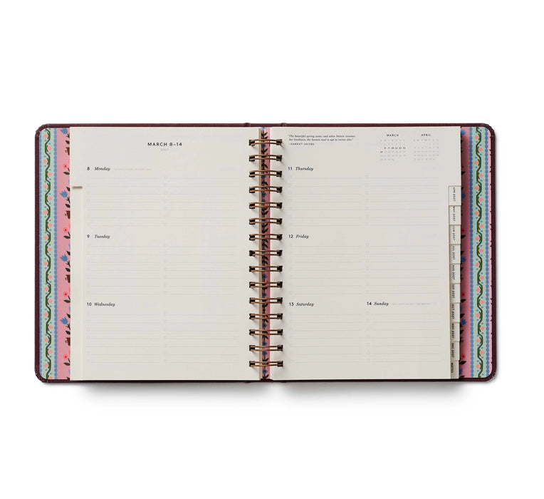Open planner with colorful design on a white background