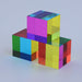 Stack of transparent, multicolored cubes on a light gray background