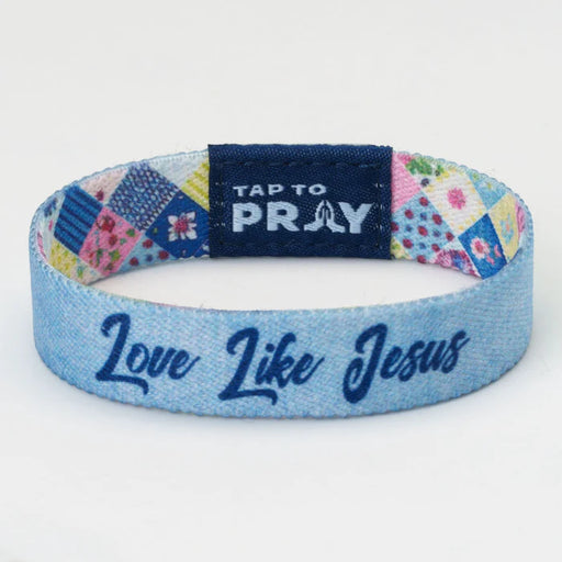 Blue wristband with 'Love Like Jesus' text and 'Tap to Pray' tag on a white background