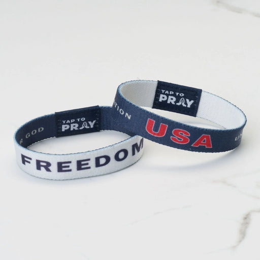 Two wristbands with text on a white background
