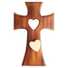 Wooden cross with a heart cutout on a white background