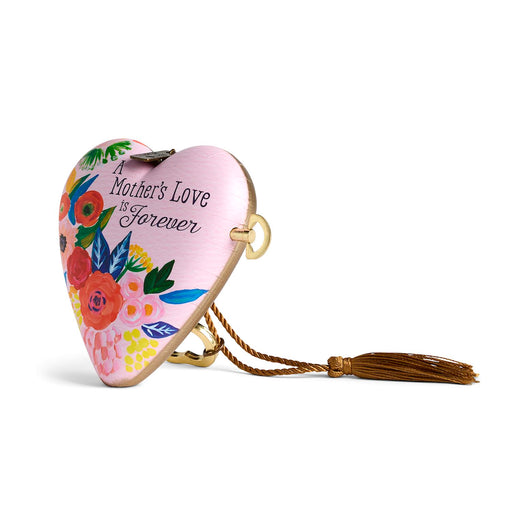 Heart-shaped decorative item with floral designs and 'A Mother's Love is Forever' text on a white background