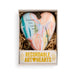 A heart-shaped ceramic ornament in a gift box, featuring a pastel marbled design with the text 'Sister how lucky are we?' and a small hanging tag. The box has a white base with gold lettering that reads 'RECORDABLE ART HEARTS'.