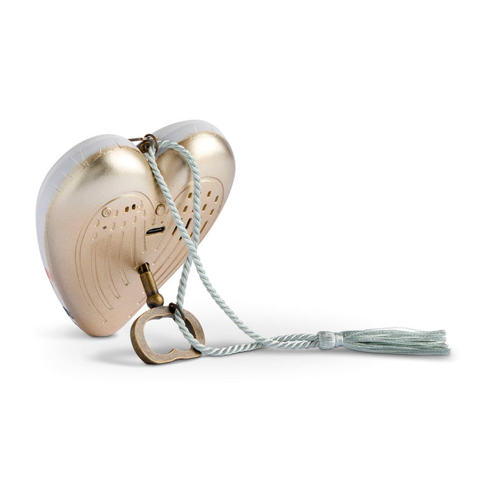 A heart-shaped metallic gold keepsake box with a white braided rope and tassel, shown on a clean white background.