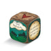 Decorative dice with inspirational text and nature-themed design on a white background
