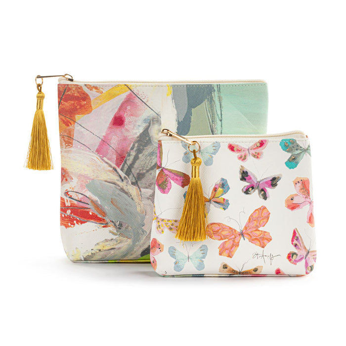 Two pouches with butterfly designs and gold tassels on a white background