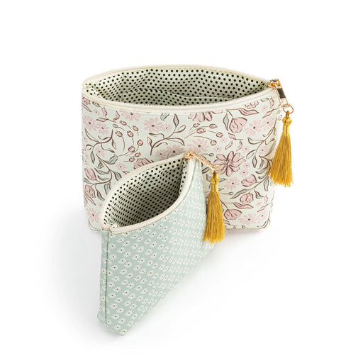 Two fabric bags with floral and polka dot patterns and yellow tassels on a white background.