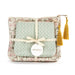Floral-patterned pouch with a bow and tassels, featuring the Demdaco brand.