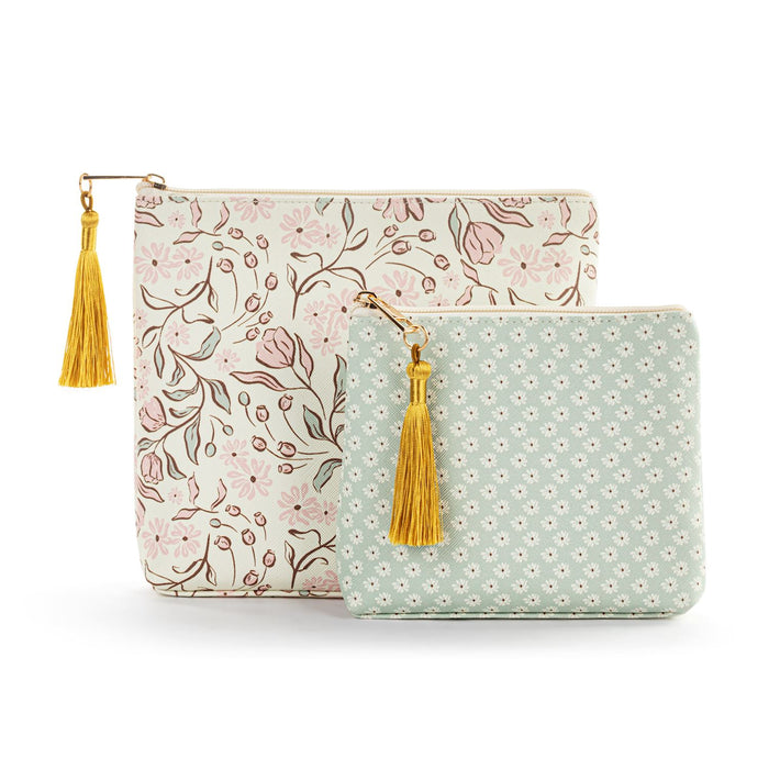 Two patterned pouches with yellow tassels on a white background