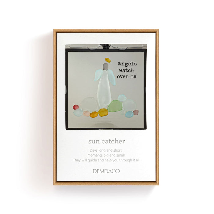 Framed artwork with angel design and text on a white wall