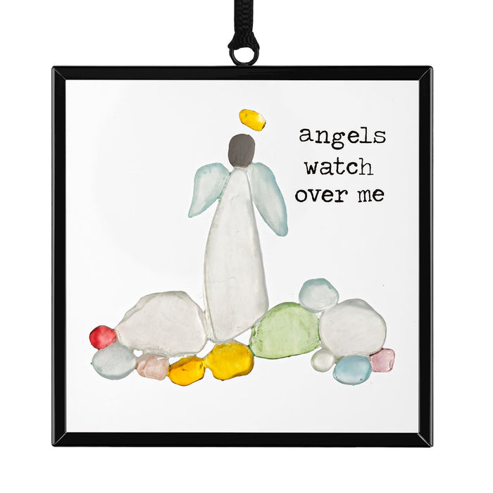 Decorative angel ornament with colorful stones and 'angels watch over me' text on a white background.