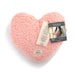 Pink heart-shaped weighted cushion with a tag on a white background