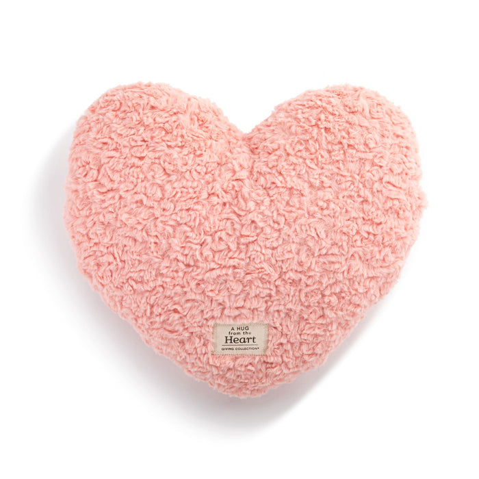 Pink heart-shaped pillow on a white background
