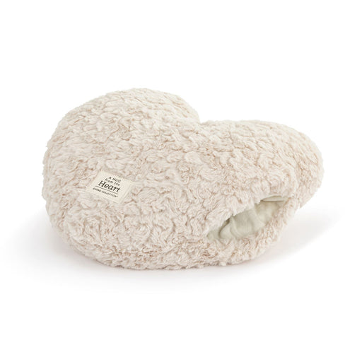Heart-shaped pillow with sherpa texture on a white background