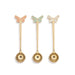 Three gold spoons with butterfly ends on a white background