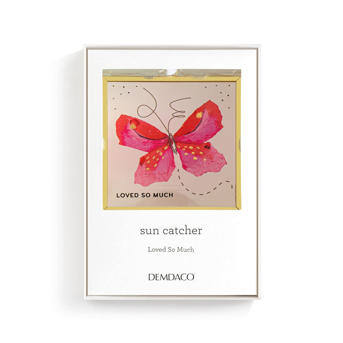 Framed artwork with a pink butterfly design and text on a white background