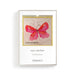 Framed artwork with a pink butterfly design and text on a white background