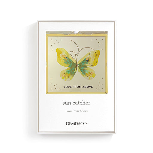 Framed artwork with a butterfly design and text on a white background