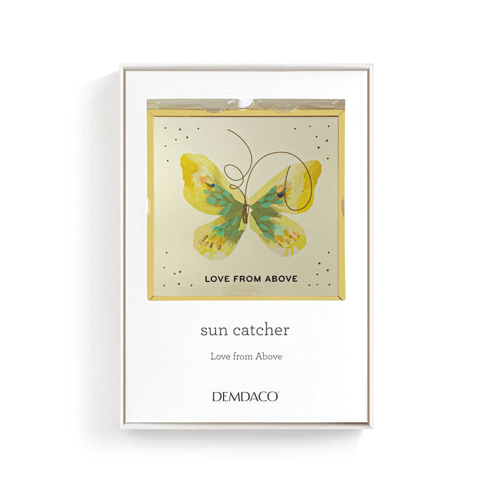 Framed artwork with a butterfly design and text on a white background