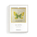 Framed artwork with a butterfly design and text on a white background