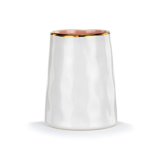 White ceramic tumbler with gold rim on a white background