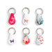 Set of six teardrop-shaped keychains with floral and butterfly designs on a white background