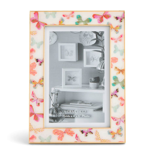 Decorative photo frame with butterfly design on a white background