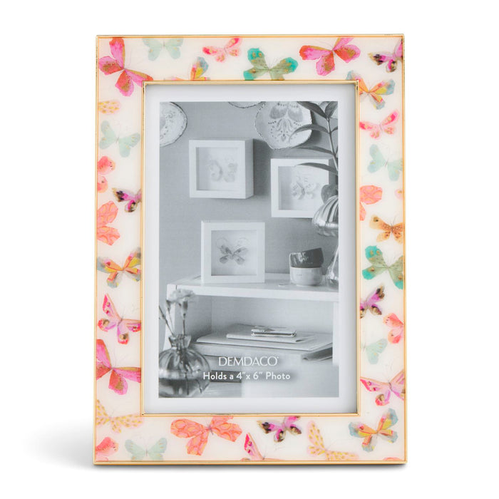 Decorative photo frame with butterfly design on a white background