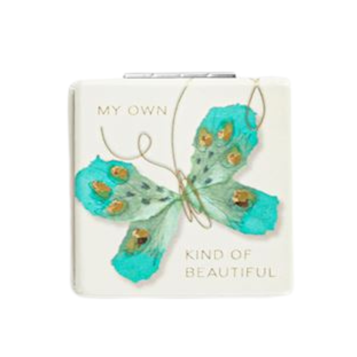 Notebook with a turquoise butterfly design on a white background