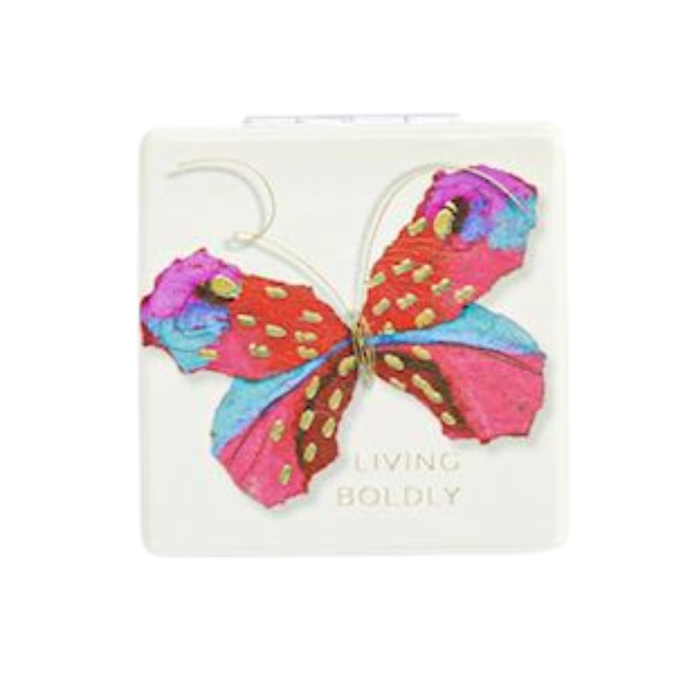 Colorful butterfly-shaped earrings on a white card with 'Living Boldly' text.