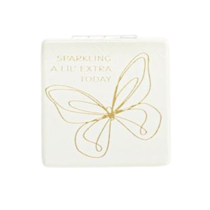 Small white box with gold butterfly design and text on a white background