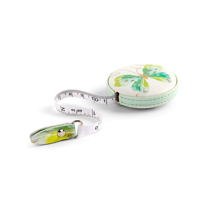 Measuring tape with floral design on a white background