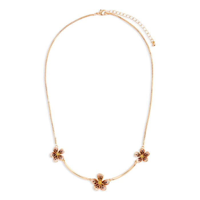 Gold necklace with floral pendants on a white background