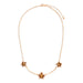 Gold necklace with floral pendants on a white background