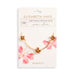 Gold necklace with pink floral design on a white card with 'Elisabeth Hays' branding.
