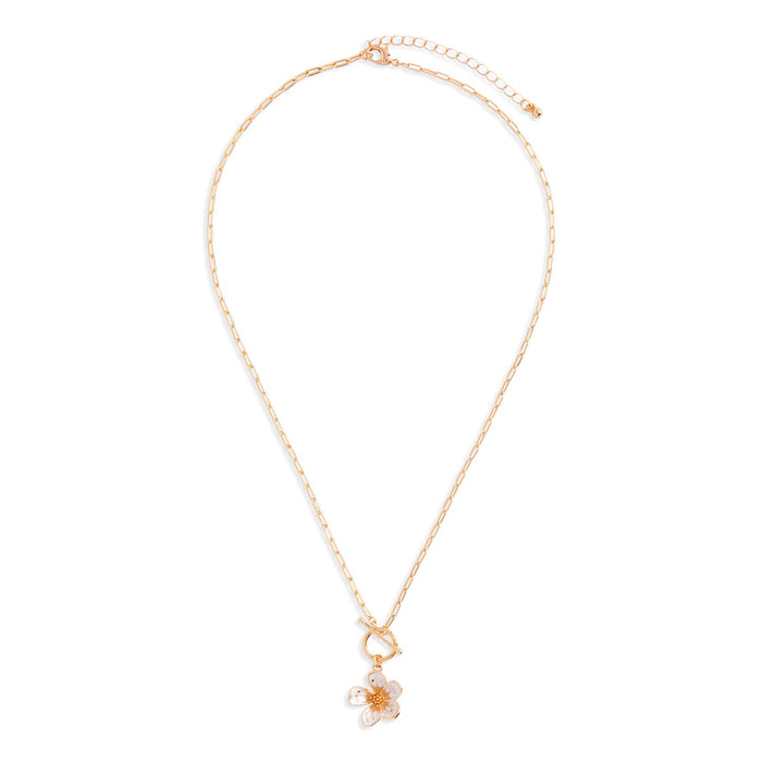Gold necklace with a floral pendant on a white background