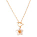 Gold necklace with a floral pendant on a white background