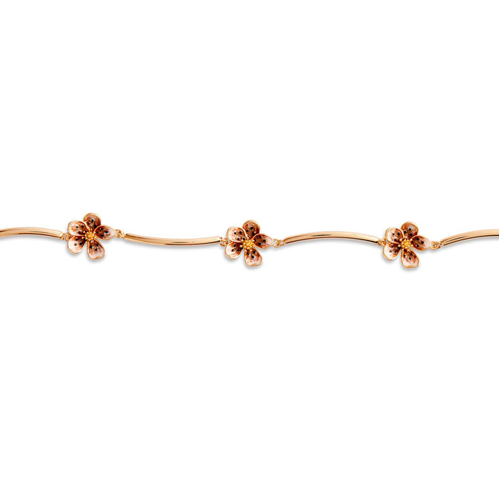 Gold floral headband on a white background