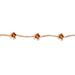Gold floral headband on a white background