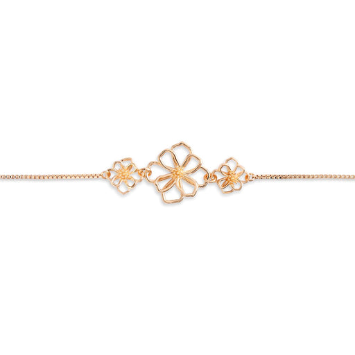 Gold bracelet with floral designs on a white background