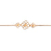 Gold bracelet with floral designs on a white background