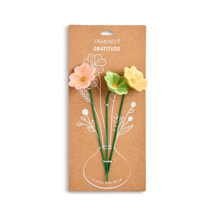Floral-themed pencils in packaging with 'Demdaco' branding on a white background