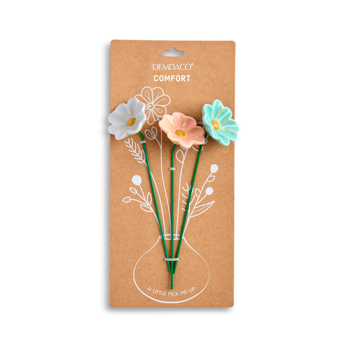 Packaged flower-shaped picks with 'DemiDeco' branding on a white background