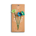 Packaged flower-shaped pins with 'Demdaco' branding on a white background