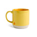 Yellow mug with a smiley face on a white background